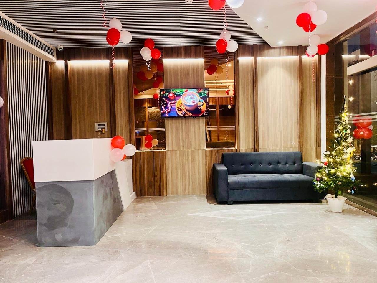 The Royal Legacy Grand Reception Lobby with Warm Wood and Marble Finishes